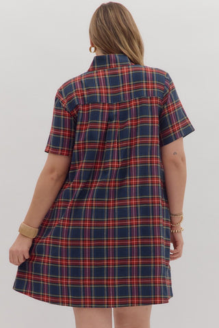 Plaid short sleeve mini dress featuring contrast buttoned placket and collar lining. Side pockets. Lined. Woven. Non-sheer. Lightweight.