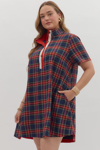 Plaid short sleeve mini dress featuring contrast buttoned placket and collar lining. Side pockets. Lined. Woven. Non-sheer. Lightweight.