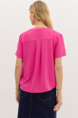 Bright Pink Top with Short Sleeves, V-Neck Cut, Lightweight Material, and Vibrant Color