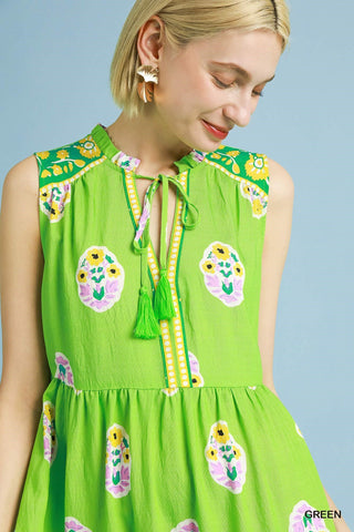 Green Midi Dress with Tie V-Neck Closure, Tiered Skirt, and Colorful Pattern