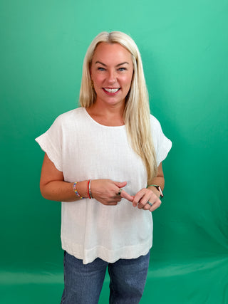 Beige Linen Blend Top with Scallop-edge Sleeves and Hem, Classic Round Neckline and Breezy Silhouette.