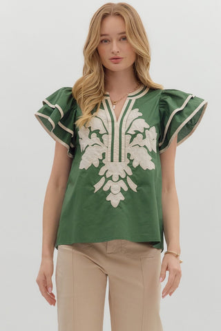 Solid flutter sleeve mutlicolor accent V-neck top featuring embroidered applique at front. Unlined. Woven. Non-sheer. Lightweight.