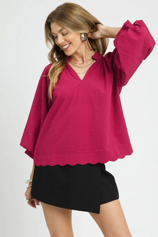 Crimson textured stop with scallop edge, balloon sleeves, and split v-neckline. Lightweight. Un-lined.