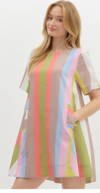 Multicolor striped round neck short sleeve mini swing dress featuring pocket at front. Back neck keyhole button closure. Lined. Woven. Non-sheer. Lightweight.