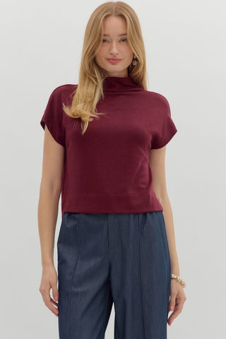 Solid knit mock neck pullover top. Unlined. Knit. Non-sheer. Lightweight.