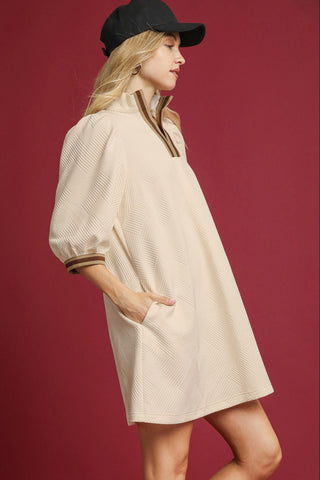High Neck Jacquard Mini Dress with 3/4 length puff sleeves, High collar with contrast trim, and pockets. Unlined.