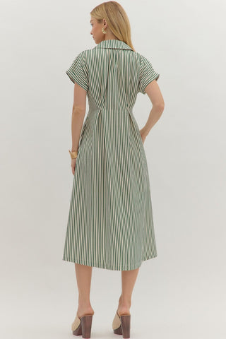 Striped short sleeve midi dress featuring shirt collar, pleated waist seam. Side pockets. Button closure at front. Zipper at side. Lined. Woven. Non-sheer. Lightweight.