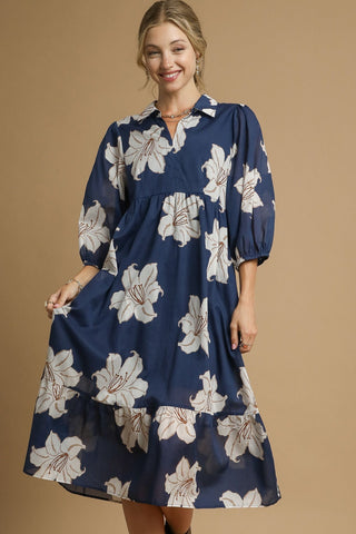 Navy Midi Dress with White Floral Design, Collared Neckline with Button Front, Tiered Silhouette, and Three Quarter Puff Sleeves