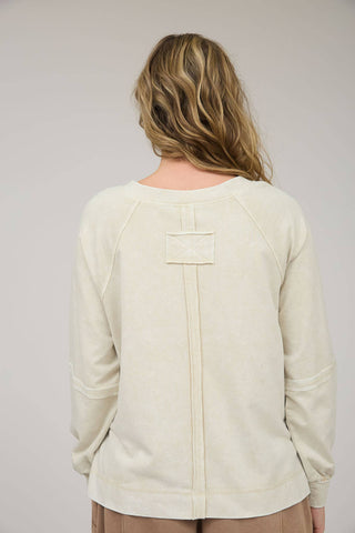 V NECKLINE LONG SLEEVES EXTENDED SHOULDER EXPOSED SEAM PATCHWORK DETAIL WASHED KNIT TOP