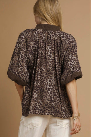 Leopard Print Blouse with V-Neckline, wide, pleated short sleeves, and contrast border placket. Unlined. Lightweight.