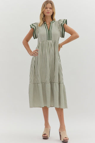 Textured stripe pattern tiered ruffle flutter sleeve featuring contrast accent binding detail. Side pockets. Lined. Woven. Non-sheer. Lightweight.