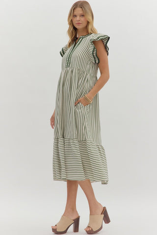 Textured stripe pattern tiered ruffle flutter sleeve featuring contrast accent binding detail. Side pockets. Lined. Woven. Non-sheer. Lightweight.