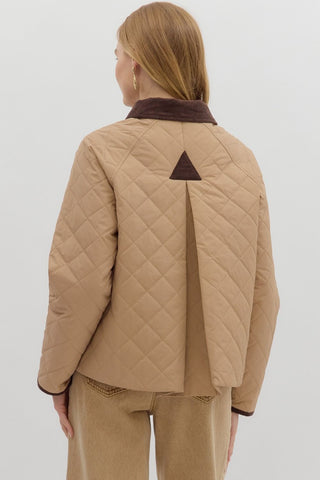 Solid diamond pattern quilted long sleeve jacket featuring contrast collar and accent binding. Front Pockets. Lined. Woven. Non-sheer. Lightweight.