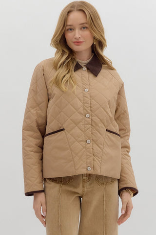 Solid diamond pattern quilted long sleeve jacket featuring contrast collar and accent binding. Front Pockets. Lined. Woven. Non-sheer. Lightweight.