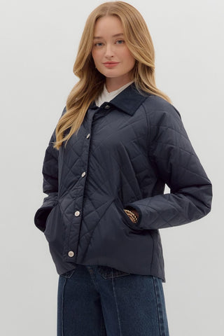 Solid diamond pattern quilted long sleeve jacket featuring contrast collar and accent binding. Front Pockets. Lined. Woven. Non-sheer. Lightweight.