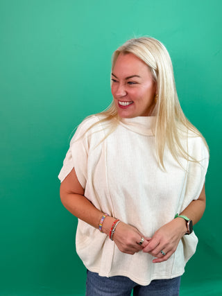 Cream Soft Knit Pullover Top with Mock Neck and Topstitching.