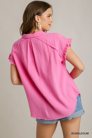Vibrant pink button up top with short ruffle sleeve and frayed hem.