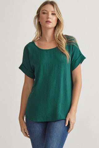 Burgundy Classic round neck short roll-up sleeve pullover top. Single button keyhole closure at back. Unlined. Woven. Non-sheer. Lightweight.