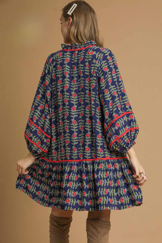 Boho-inspired Tunic Dress with Split V-Neck with Tassel Detail, Boho Contrast Piping, Three Quarter Elastic Sleeves, and Tiered Ruffle Skirt. Lined