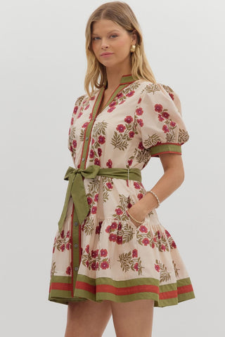 Floral pattern short puff sleeve ruffle hem mini dress featuring multicolor accent band detail. V-neck band collar button closure. Removable belt. Side pockets. Lined. Woven. Non-sheer. Lightweight.