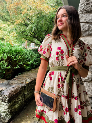 Floral pattern short puff sleeve ruffle hem mini dress featuring multicolor accent band detail. V-neck band collar button closure. Removable belt. Side pockets. Lined. Woven. Non-sheer. Lightweight.