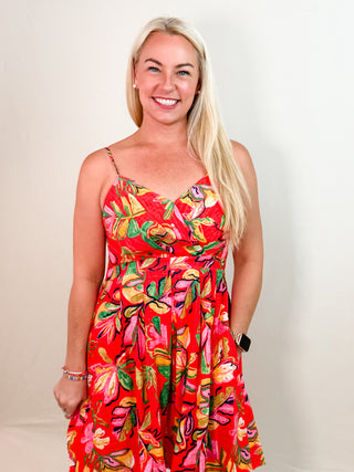 Red Mini Dress with Tropical Leaf Print, Pleated Skirt, Pockets, V-Neck Cut, and Smocked Back