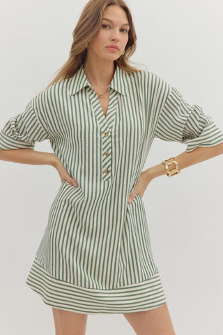 Stripe pattern ¾ cuff sleeve spread collar button front mini dress featuring pleating detail at back. Side pockets. Lined. Woven. Non-sheer. Lightweight.