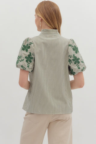 Stripe pattern V-neck ruffle band collar button front top featuring floral embroidered short bubble sleeve. Unlined. Woven. Non-sheer. Lightweight.