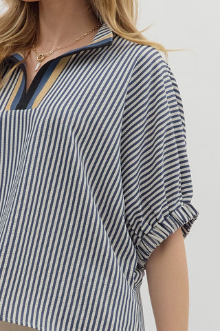 Stripe pattern high neck elasticated sleeve band dolman top featuring accented multicolor rib band split neck. Unlined. Woven. Non-sheer. Lightweight.
