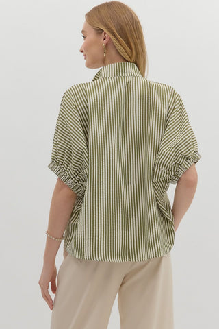 Stripe pattern high neck elasticated sleeve band dolman top featuring accented multicolor rib band split neck. Unlined. Woven. Non-sheer. Lightweight.