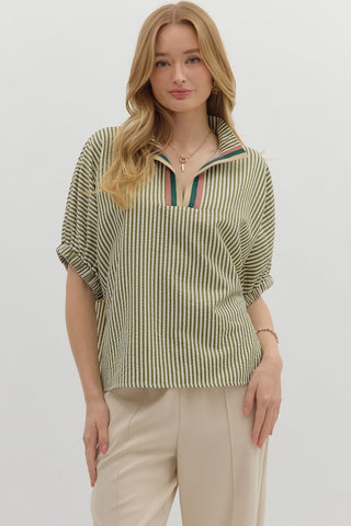 Stripe pattern high neck elasticated sleeve band dolman top featuring accented multicolor rib band split neck. Unlined. Woven. Non-sheer. Lightweight.