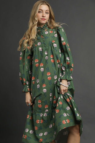 Green Floral Print Midi Dress with a High neck with subtle ruffle trim, Long puff sleeves with elastic cuffs, and tiered hem.