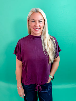 Plum Top with High Crew Neckline, Short dolman sleeves, Brushed fleece, Back keyhole, and Adjustable Bottom with Drawstring