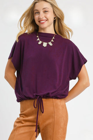 Plum Top with High Crew Neckline, Short dolman sleeves, Brushed fleece, Back keyhole, and Adjustable Bottom with Drawstring