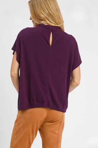 Plum Top with High Crew Neckline, Short dolman sleeves, Brushed fleece, Back keyhole, and Adjustable Bottom with Drawstring