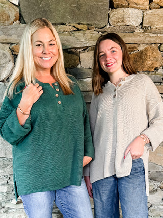Textured Button Henley Knit Sweater with Notched Neckline with Front Button Detail and High-Low Hemline with Side Slits. Unlined.