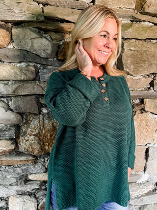 Textured Button Henley Knit Sweater with Notched Neckline with Front Button Detail and High-Low Hemline with Side Slits. Unlined.