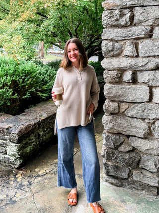 Textured Button Henley Knit Sweater with Notched Neckline with Front Button Detail and High-Low Hemline with Side Slits. Unlined.