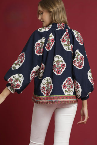 Navy boho-inspired tunic with a split v-neckline, three quarter sleeves, and a contrast border print. Unlined. Lightweight.