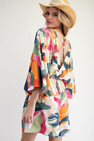 Tropical Abstract Romper with Elastic Waist, Pockets, V-Neck Front and Back Cut, and Tie Back.