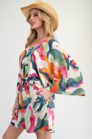 Tropical Abstract Romper with Elastic Waist, Pockets, V-Neck Front and Back Cut, and Tie Back.