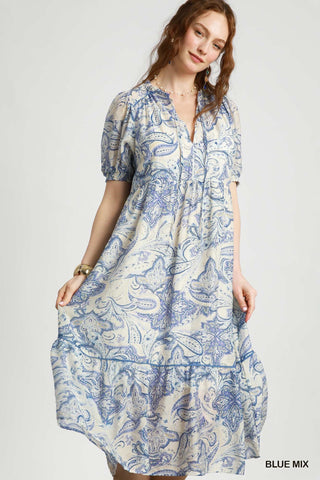 Midi Dress with blue paisley print, tiered skirt, bubble sleeve, and v-neck cut.