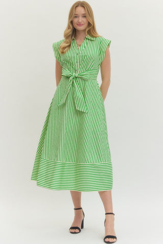 Striped cap sleeve midi dress featuring V-neck with self-tie detail at front and gathered waist. Side pockets. Lined. Woven. Non-sheer. Lightweight.