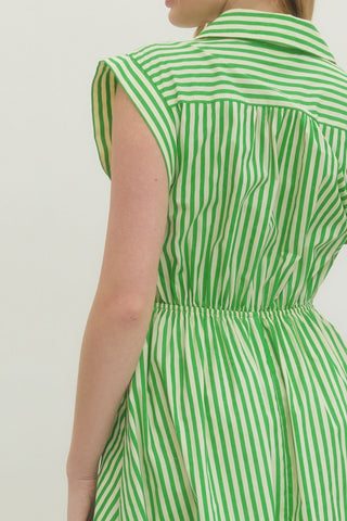 Striped cap sleeve midi dress featuring V-neck with self-tie detail at front and gathered waist. Side pockets. Lined. Woven. Non-sheer. Lightweight.