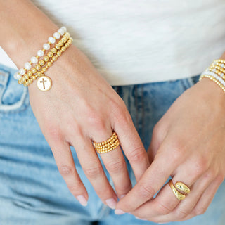 Gold Beaded Stretch Bracelet with Cut-Out Cross Charm Splendid Iris