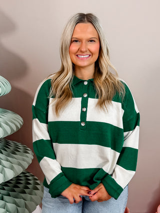 Vibrant green and white striped knit sweater with front button closure and collar. 