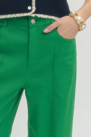 Green Solid wide leg pants featuring front pintuck detail and zip fly with button closure. Side pockets. Back pockets. Unlined. Woven. Non-sheer. Lightweight.