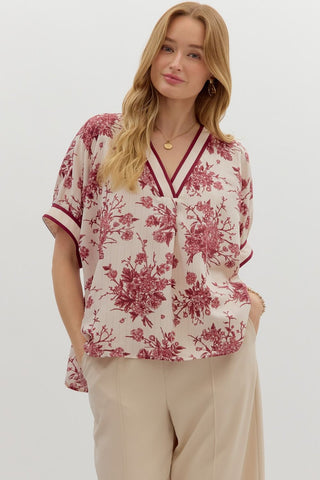 Floral print oversized pullover short dolman sleeve top featuring multicolor band. Unlined. Woven. Non-sheer. Lightweight.