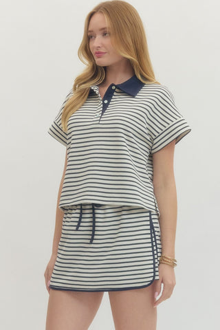 Striped short sleeve knit top featuring contrast collar and partial button closure at front. Unlined. Knit. Non-sheer. Lightweight.