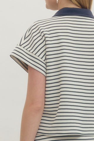 Striped short sleeve knit top featuring contrast collar and partial button closure at front. Unlined. Knit. Non-sheer. Lightweight.